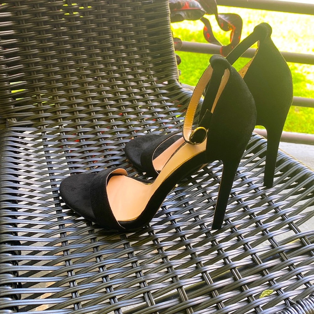 Black and gold 3 in heels with a leather type material